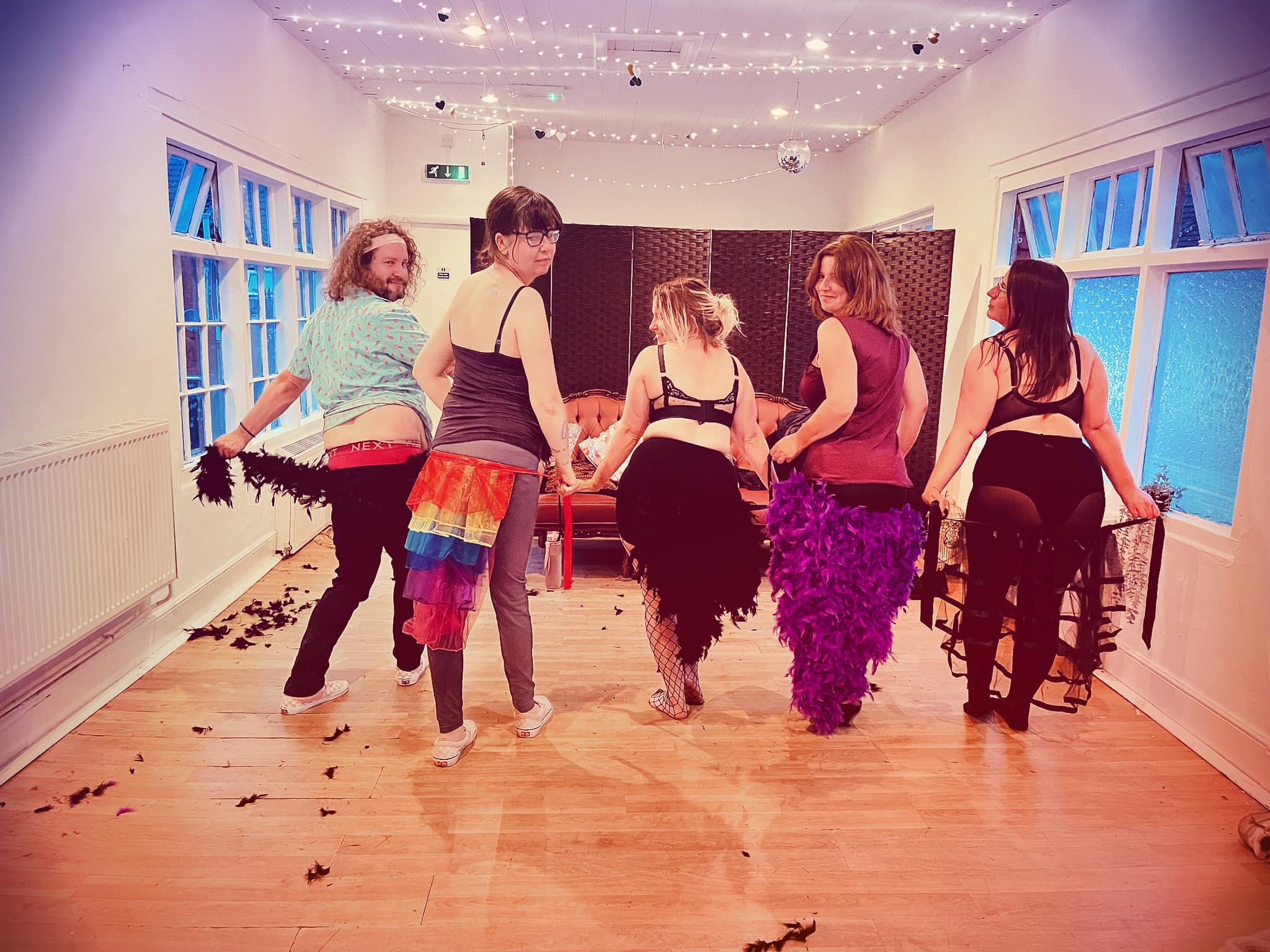A group of people taking a burlesque workshop