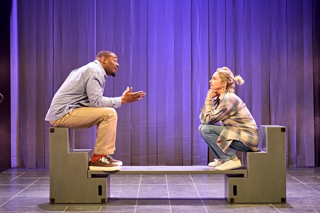 Two actors from the play The Woman