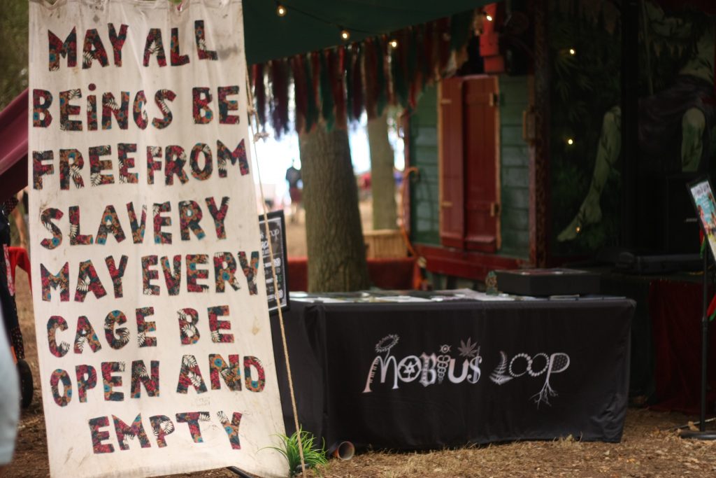 A sign says end suffering to animals.