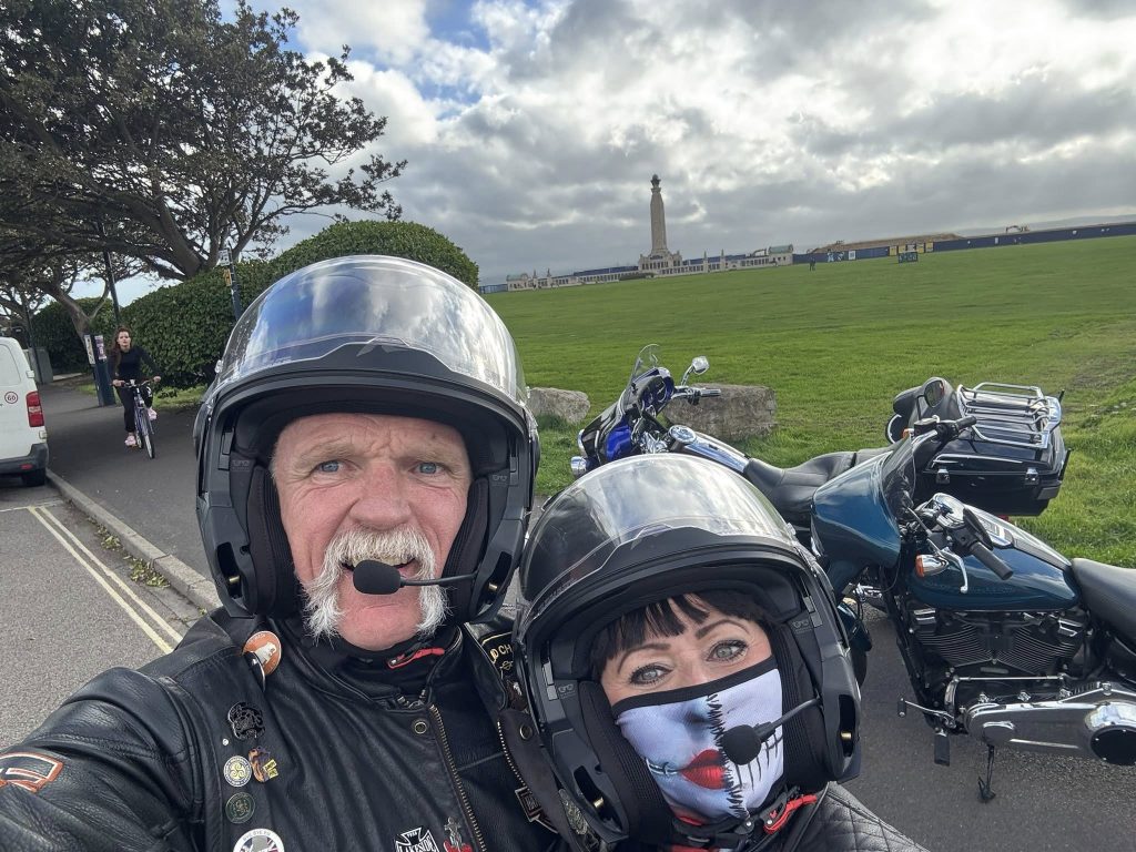 Two riders' faces with helmets.