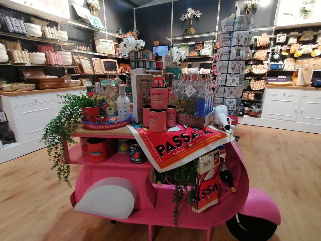 Pink tricycle at garden centre