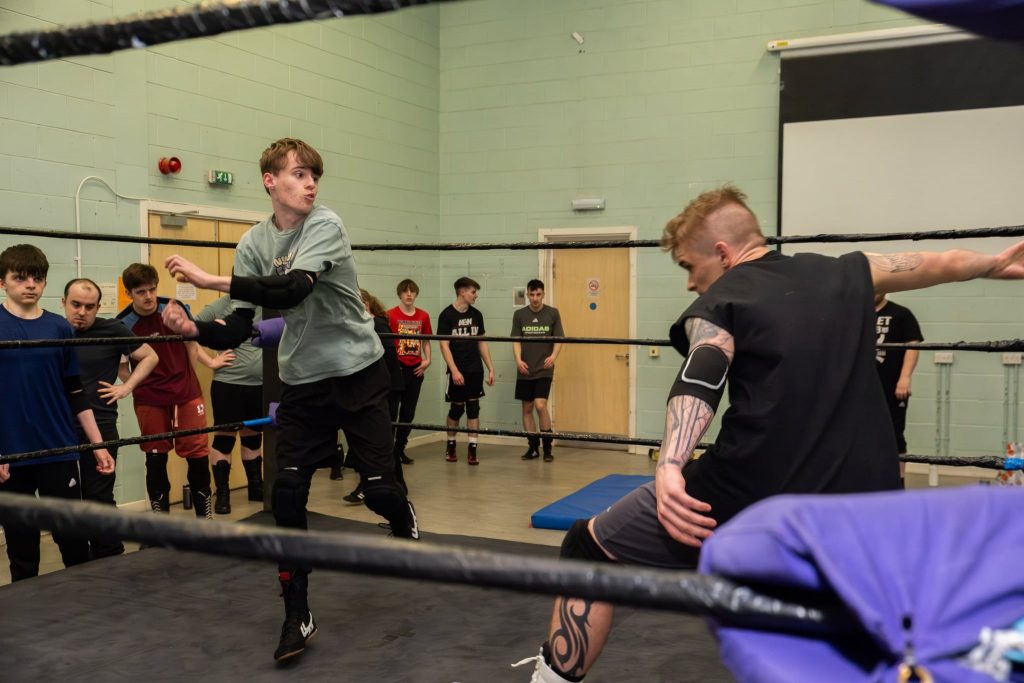 Two men fight at WIN wrestling training academy