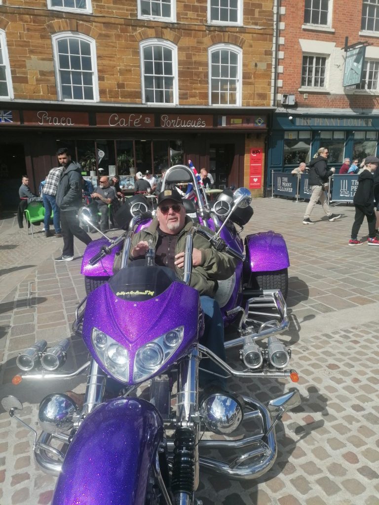 a man on a purple harley