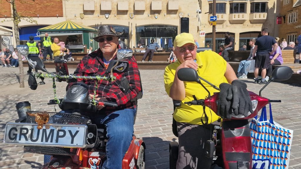 Two men on disability buggies