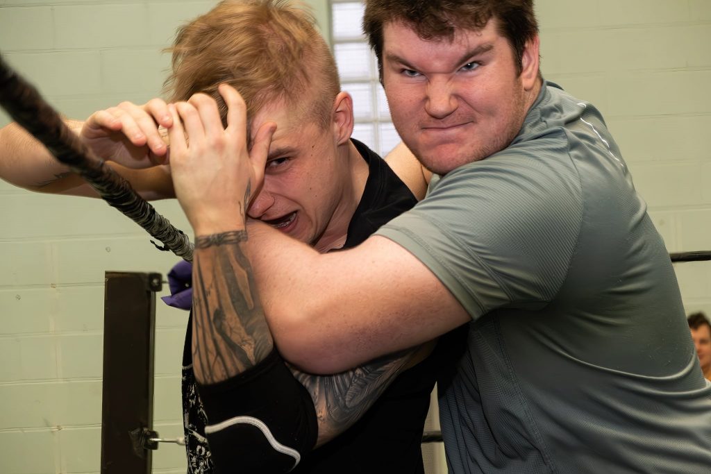 Two men hustle in WIN Wrestling