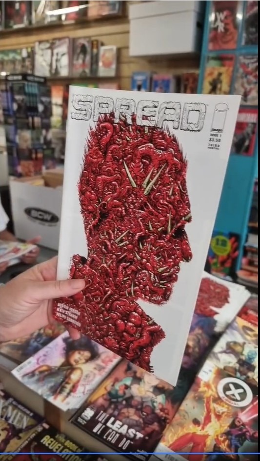 Cover of a comic called  spread