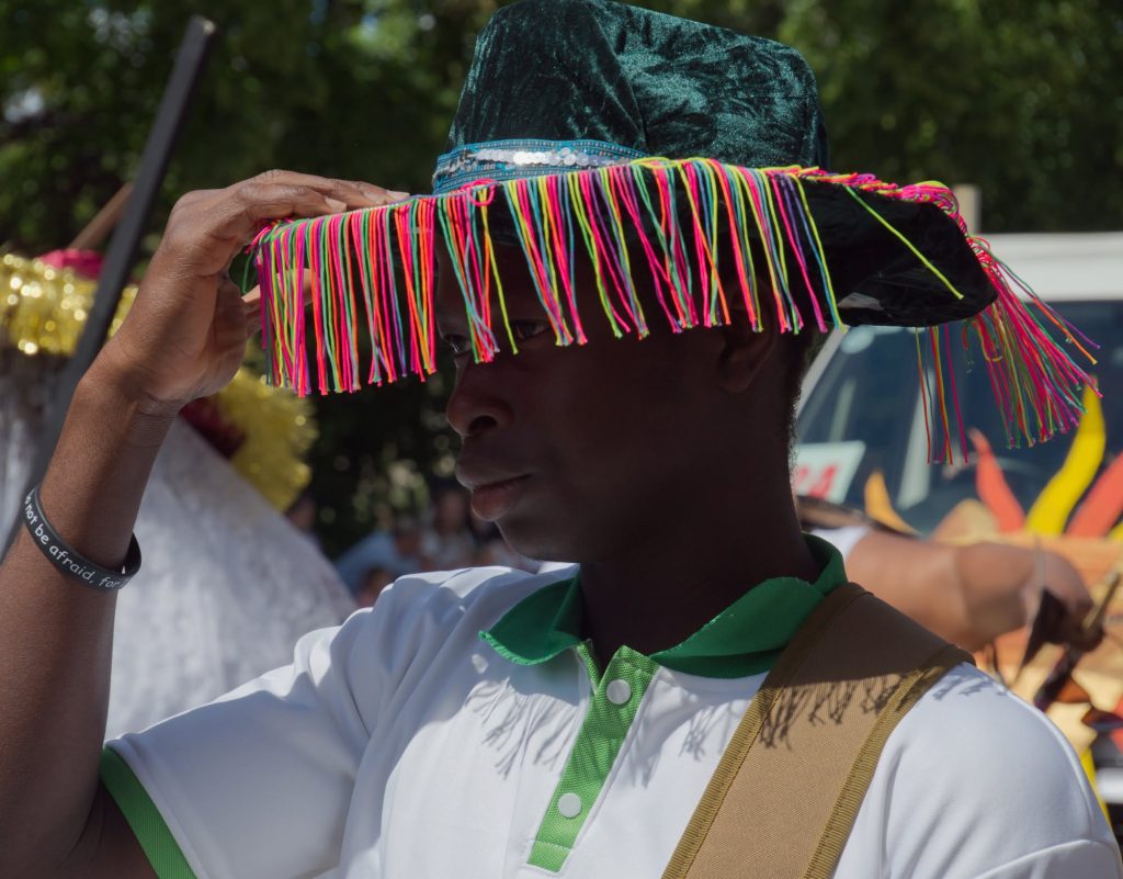 A man in colourful hat at Northampton cArnival 2026