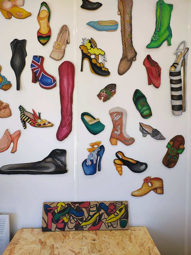 A painting by artist Helna Joseph of many shoes
